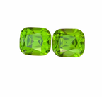 Two bright green cushion-cut faceted gemstones peridots pairs